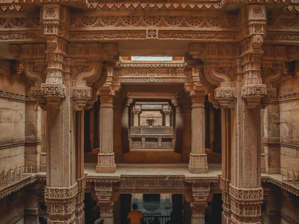 Intricate stone carvings and pillars inside Adalaj Stepwell near Ahmedabad
