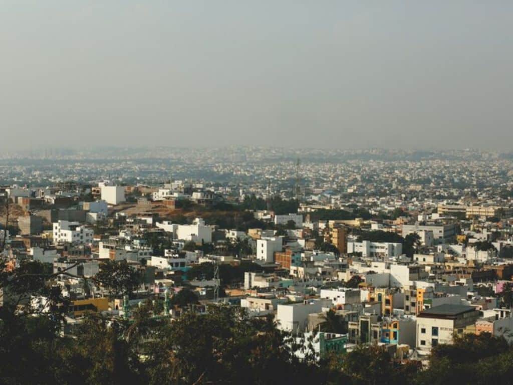 Panoramic view of Junagadh city with clustered houses and hills in Gujarat