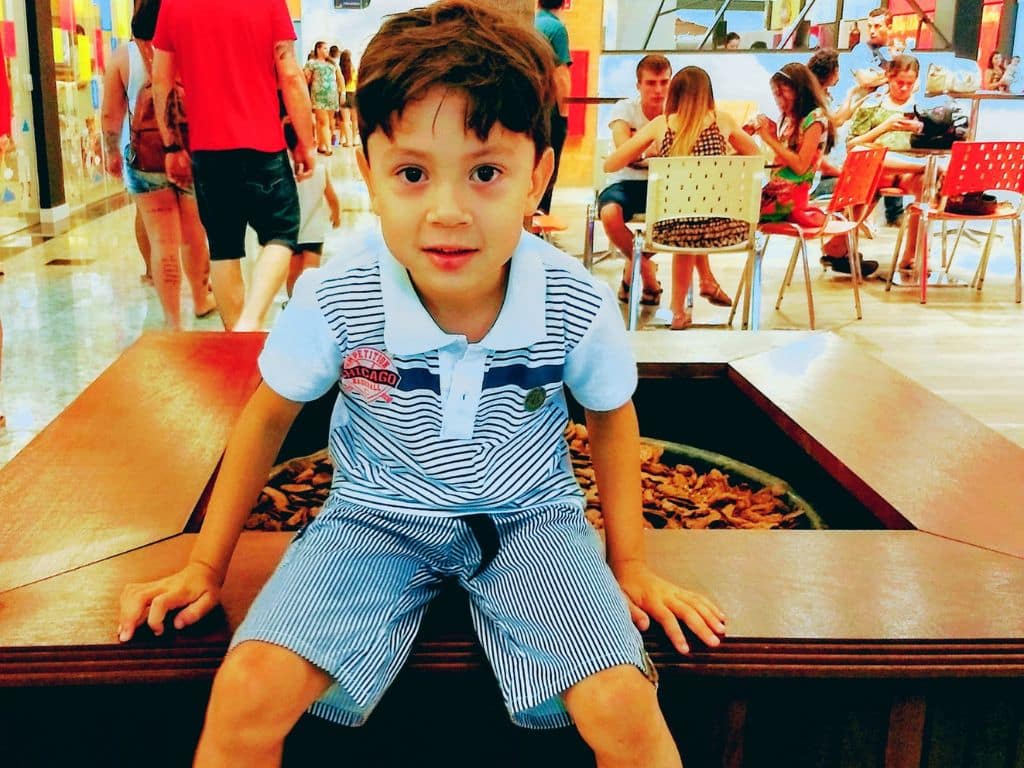 Child enjoying a fun murder mystery escape room birthday party activity