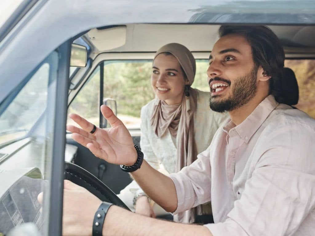 Couple enjoying a scenic drive near Ahmedabad, a perfect romantic getaway experience together