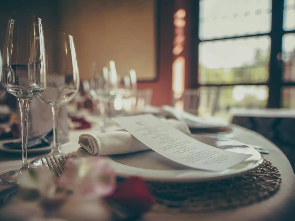 Elegant fine dining table setup for a romantic anniversary dinner in Ahmedabad.